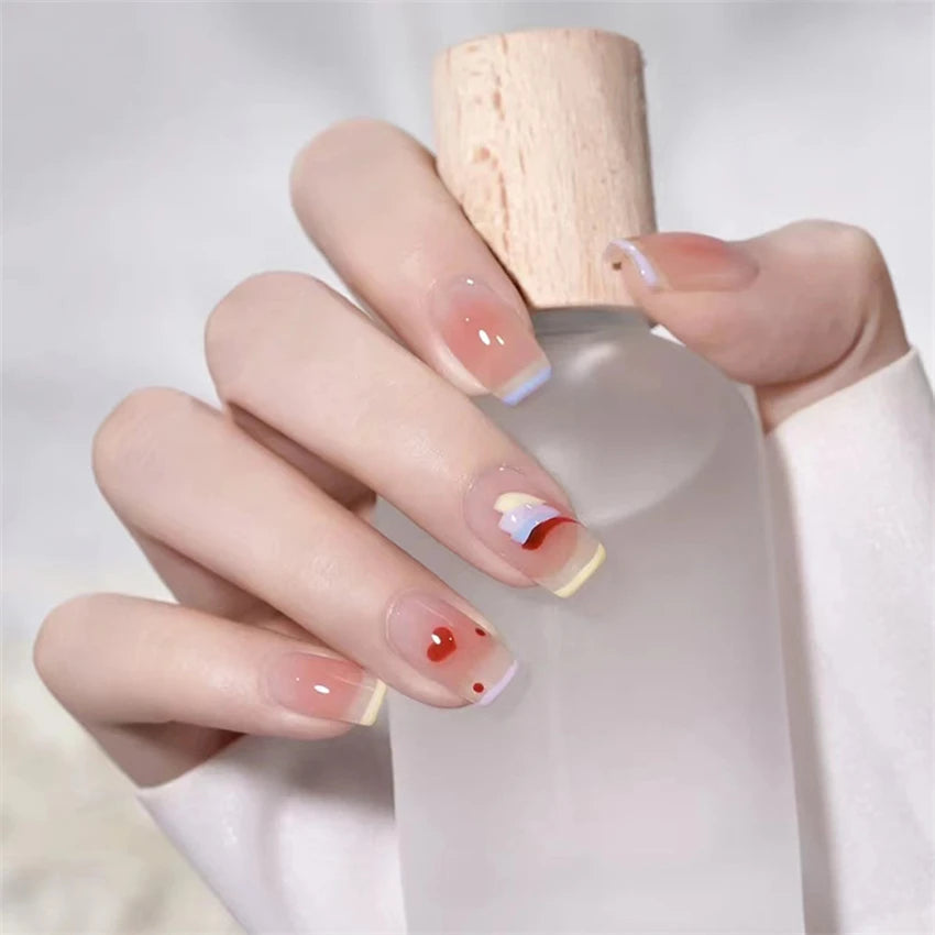 Decorated nail designs shown on hands