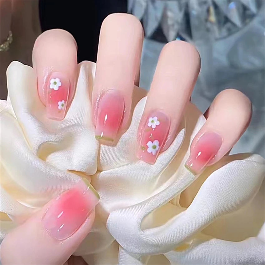 Decorated nail designs shown on hands