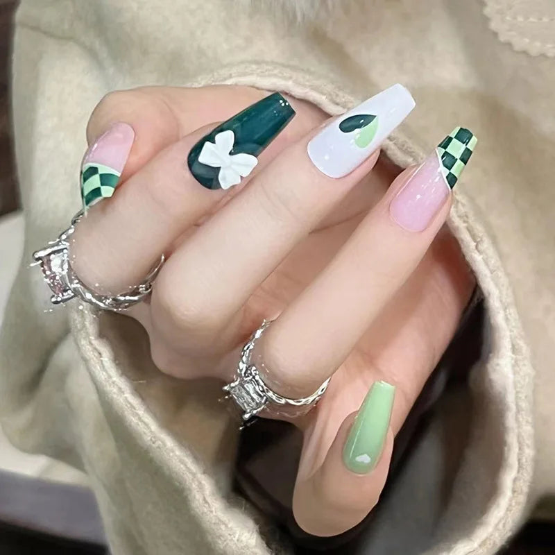 Decorated nail designs shown on hands
