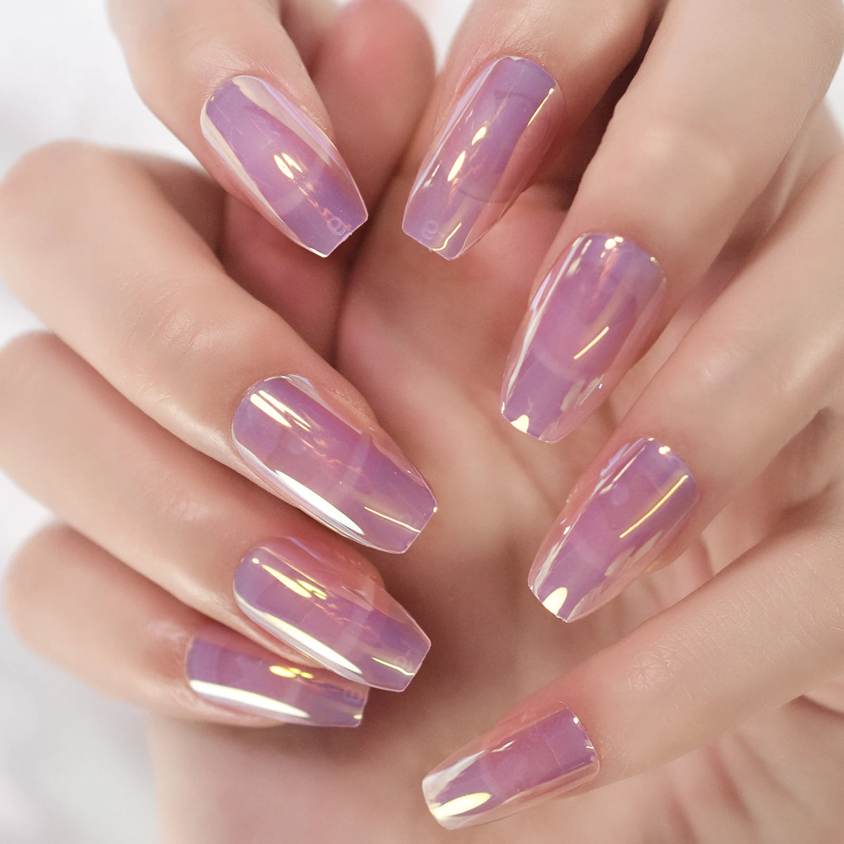 Chrome-finish nails shown on hands