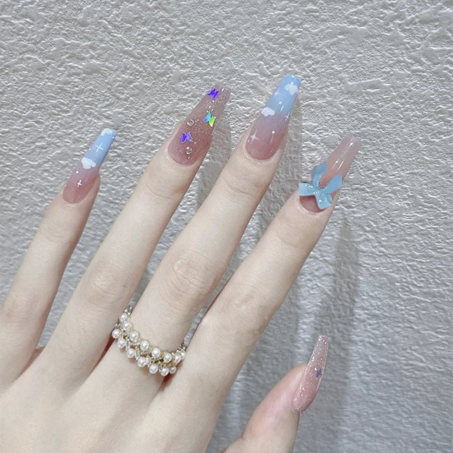 Decorated nail designs shown on hands