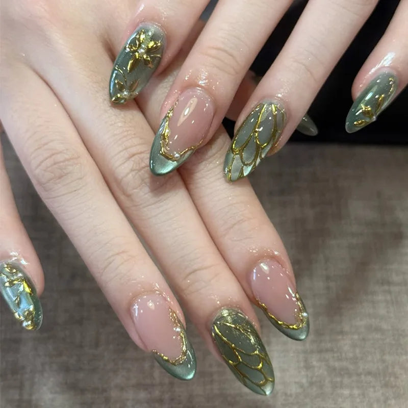Metallic and embellished nails shown on hands