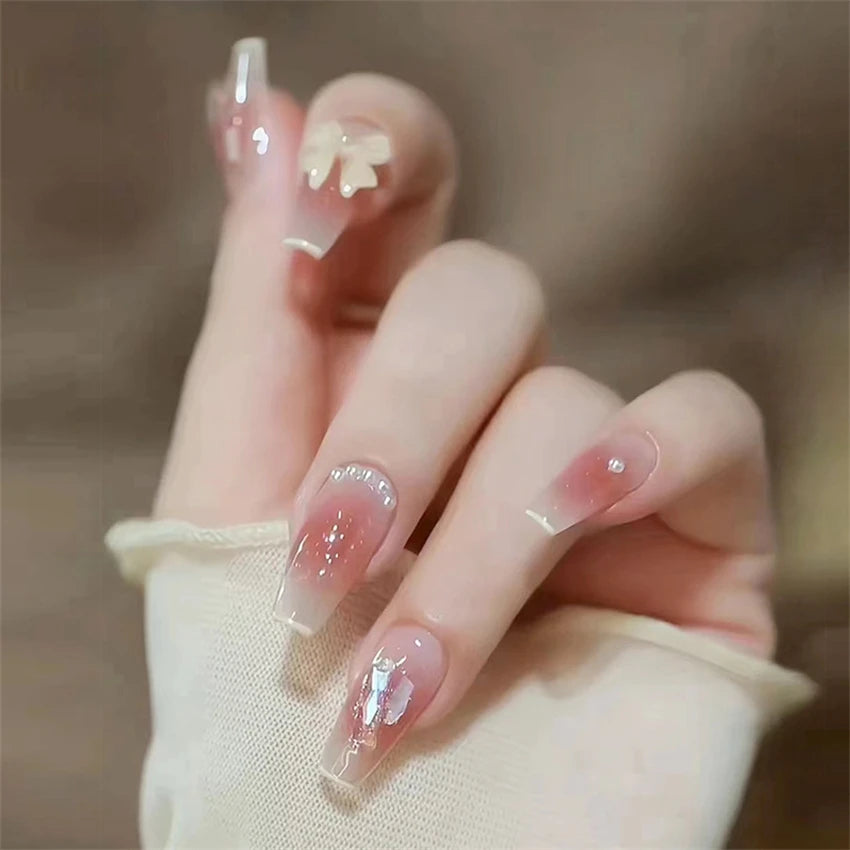 Decorated nail designs shown on hands