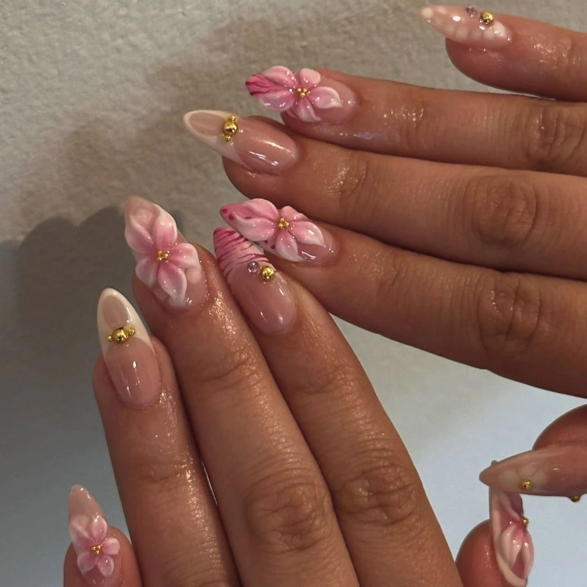 Decorated nail designs shown on hands