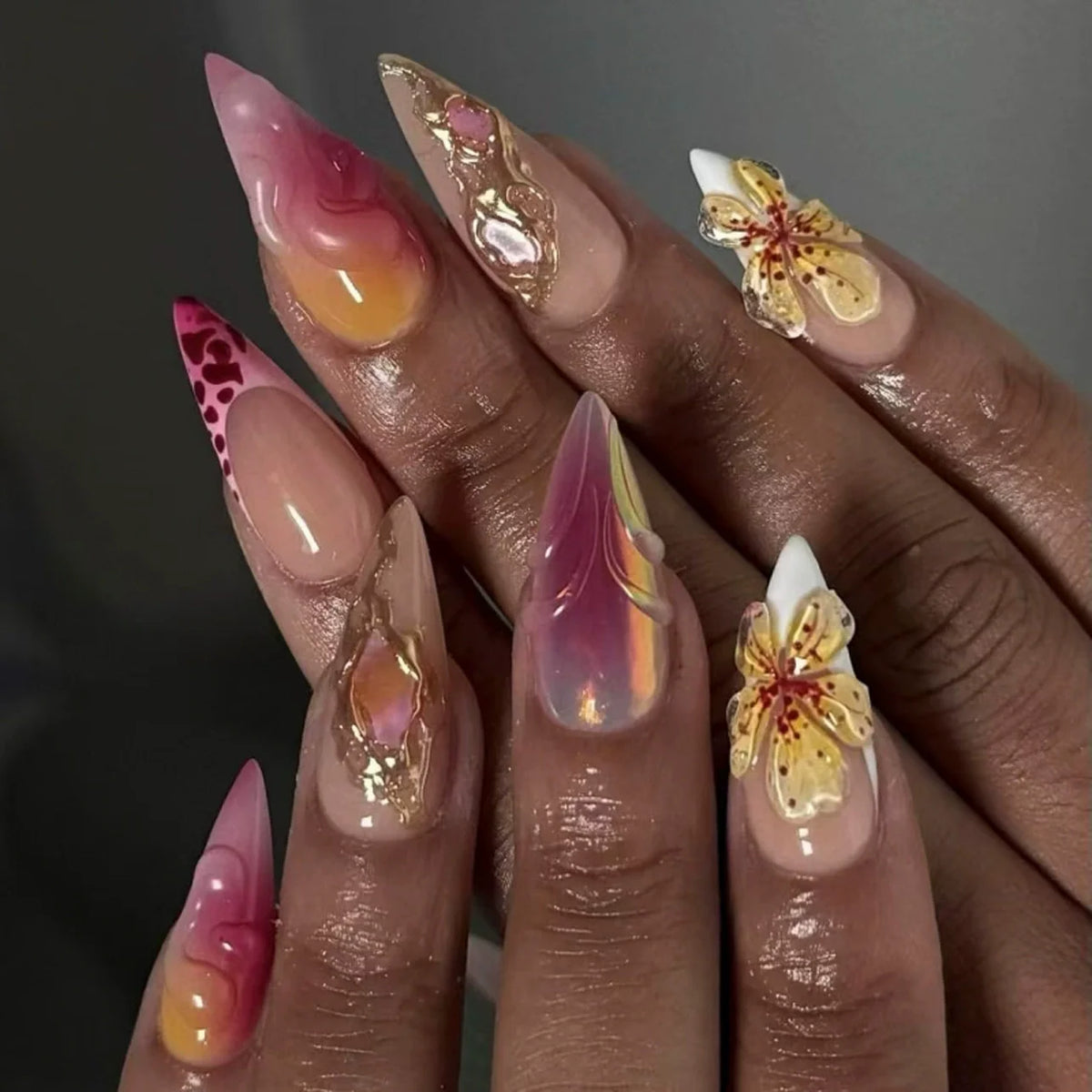 Decorated floral nails shown on hands
