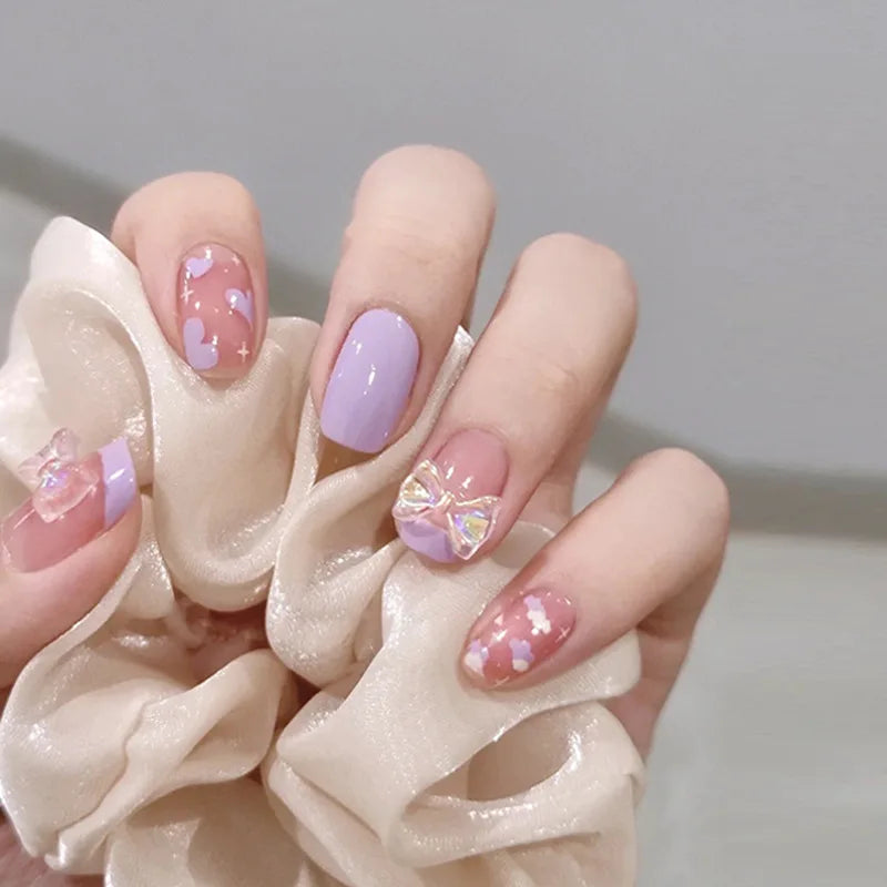 Decorated nail designs shown on hands