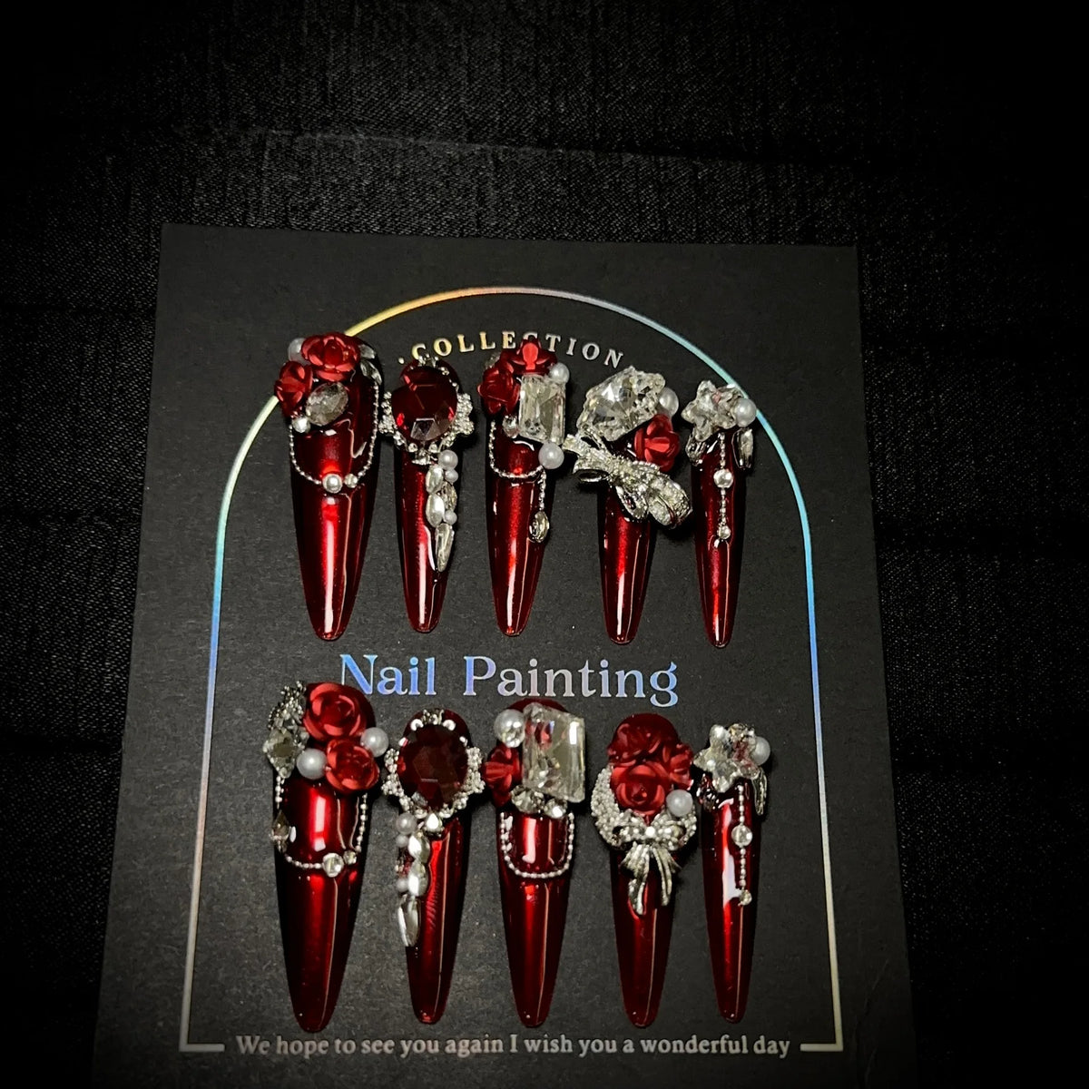 Gem-encrusted press-on nail set with size label