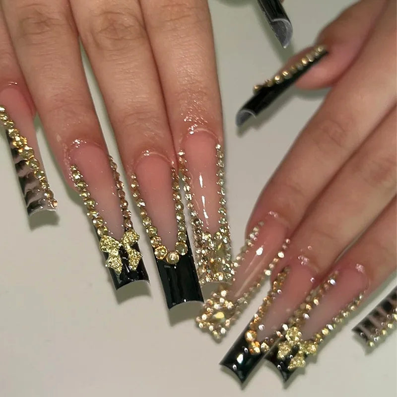 Long decorated nail designs shown on hands