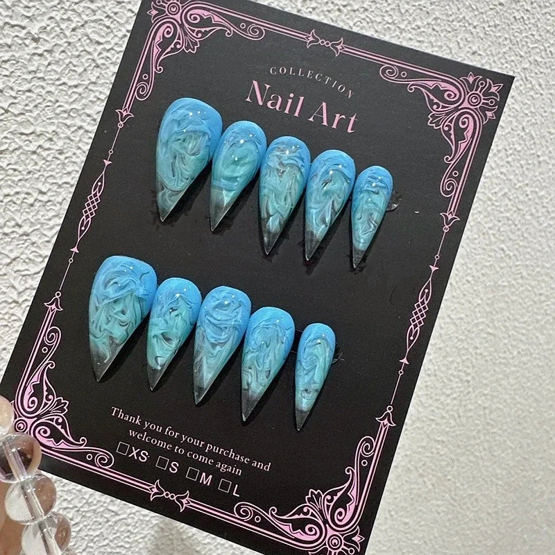 Decorated pointed press-on nails arranged in two rows