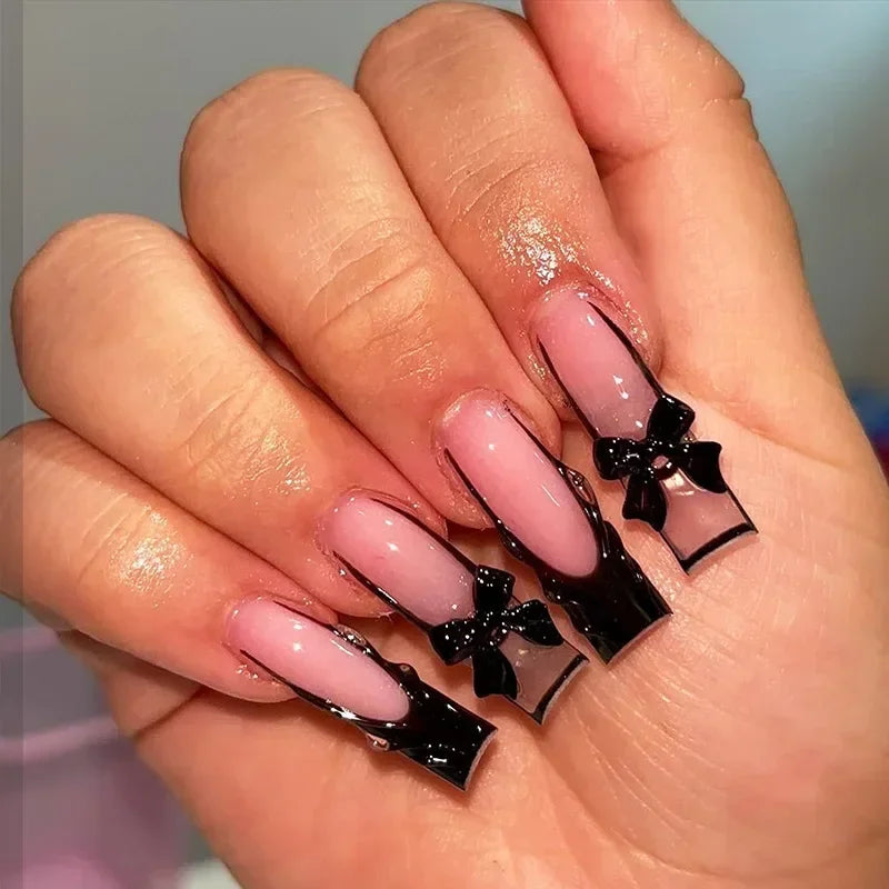 Decorated nail designs shown on hands