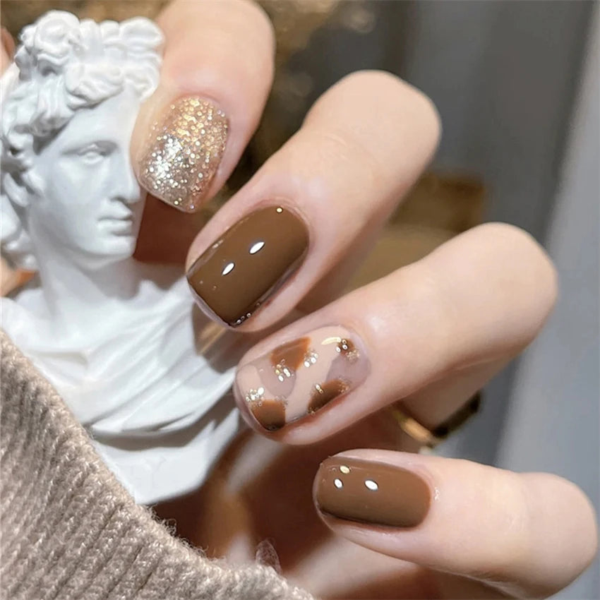 Decorated nail designs shown on hands