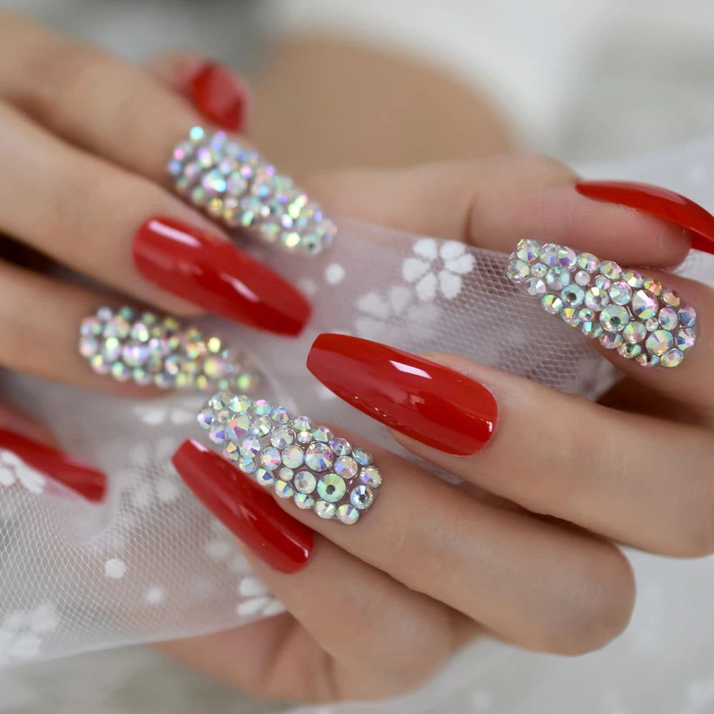 Rhinestone-decorated nail designs shown on hands