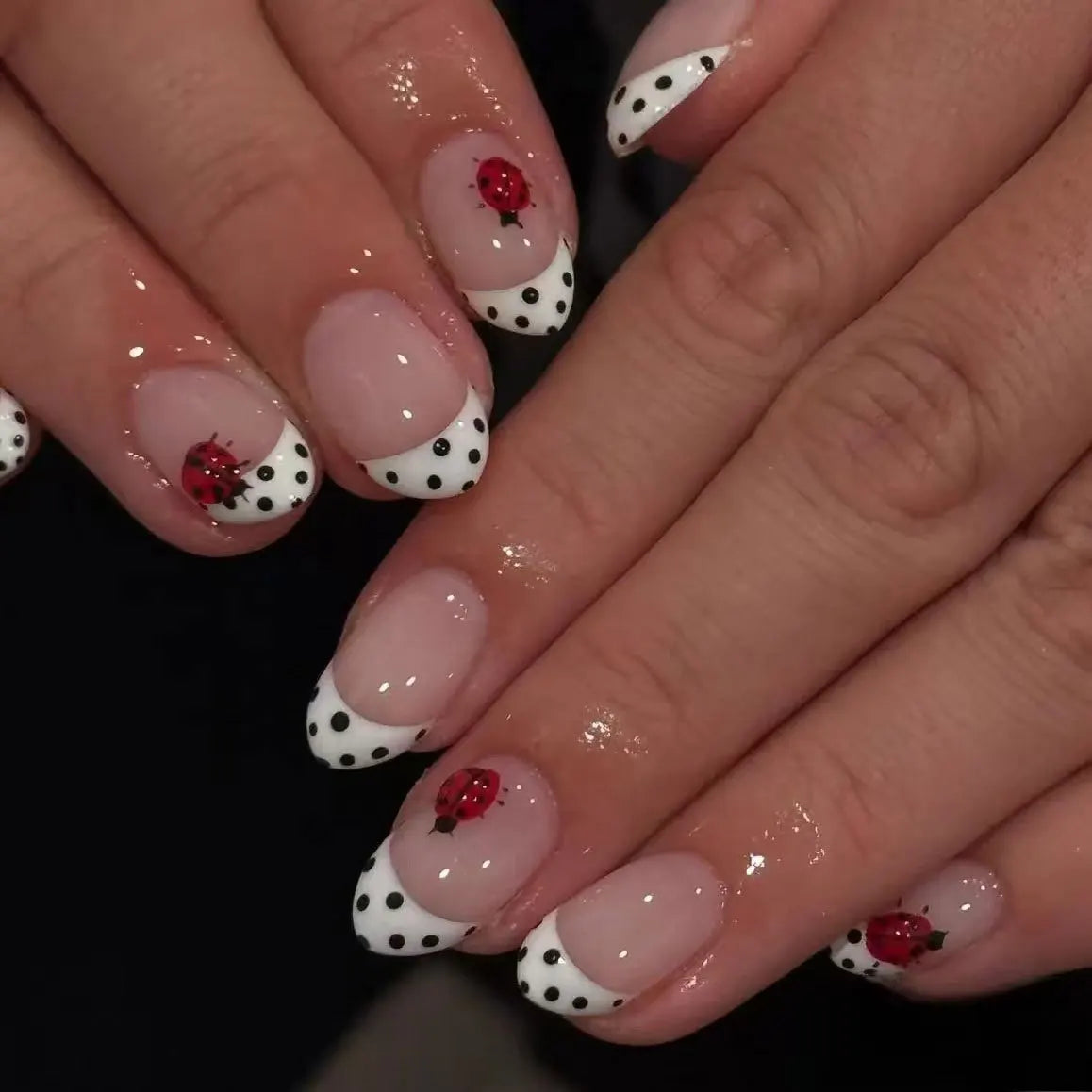 Decorated nail designs shown on hands