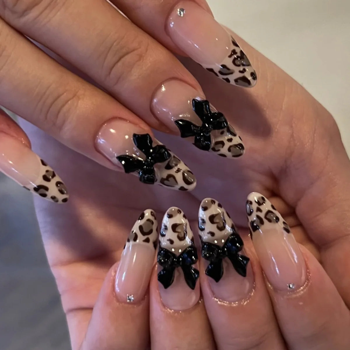 Decorated nail designs shown on hands