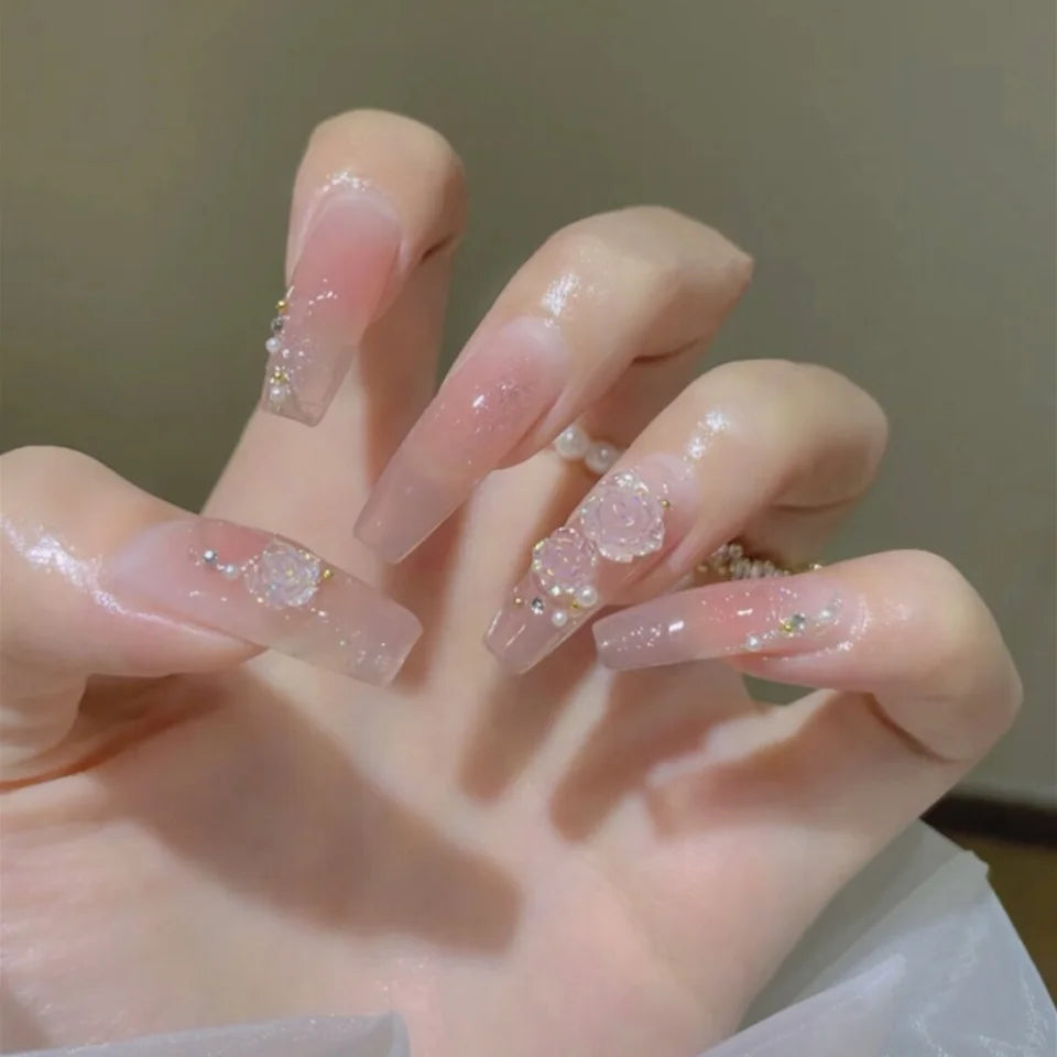 Decorated long nail designs shown on hands