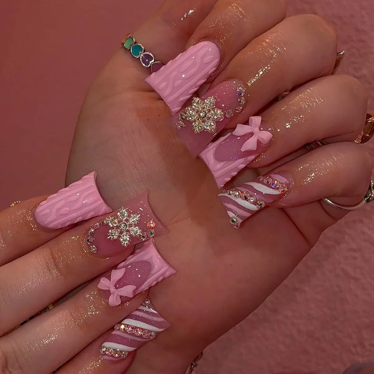 Decorative nail designs with raised accents shown on hands