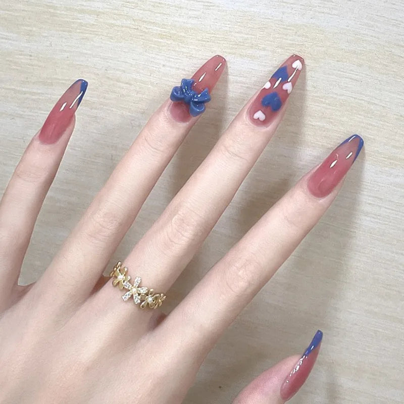 Decorated nail designs shown on hands