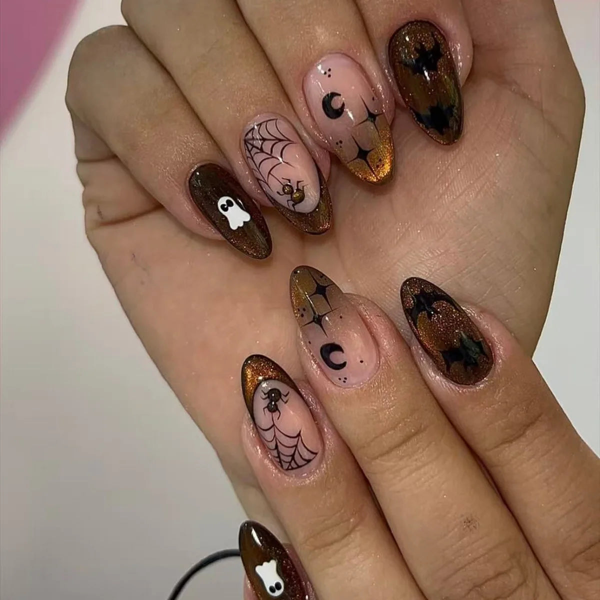 Decorated nail designs shown on hands