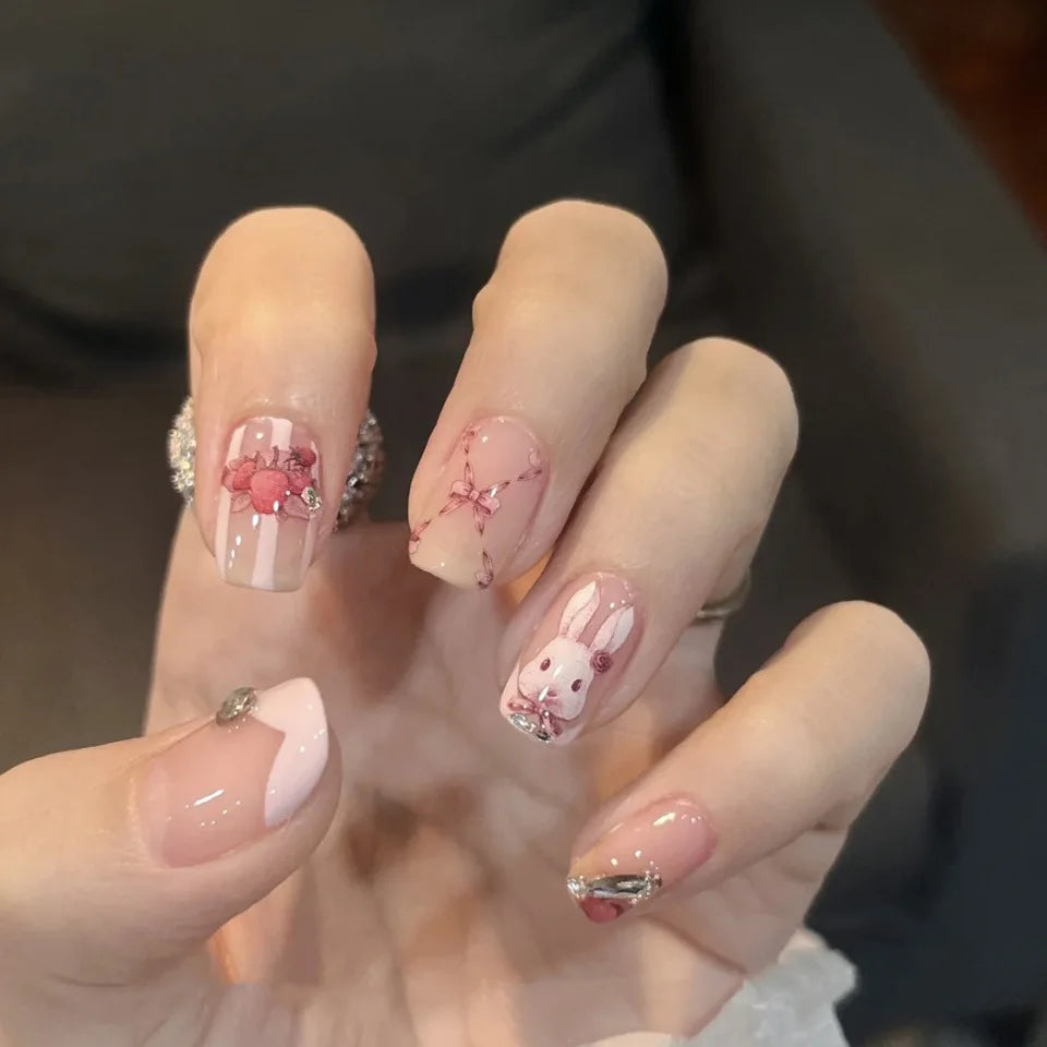 Decorated nail designs shown on hands