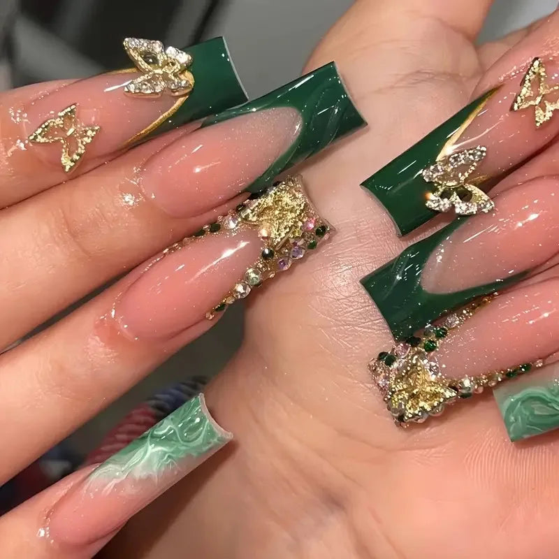 Long decorated nail designs shown on hands