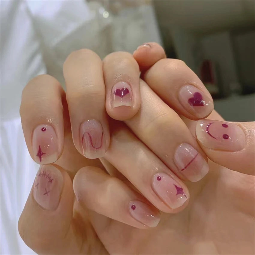 Decorated nail designs shown on hands