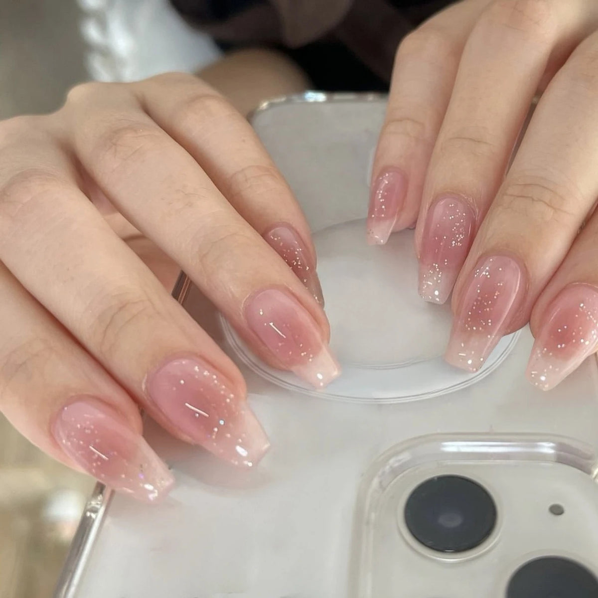 Decorated nail designs shown on hands