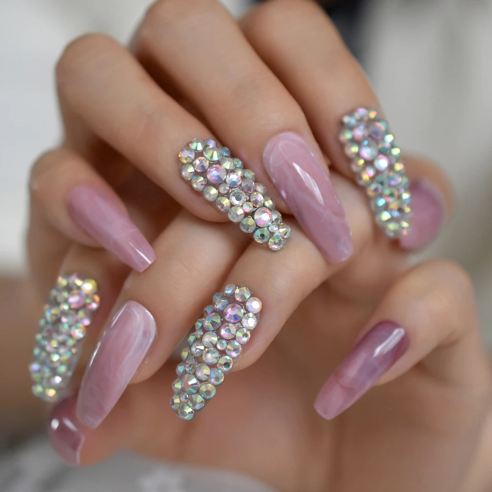 Rhinestone-decorated nail designs shown on hands