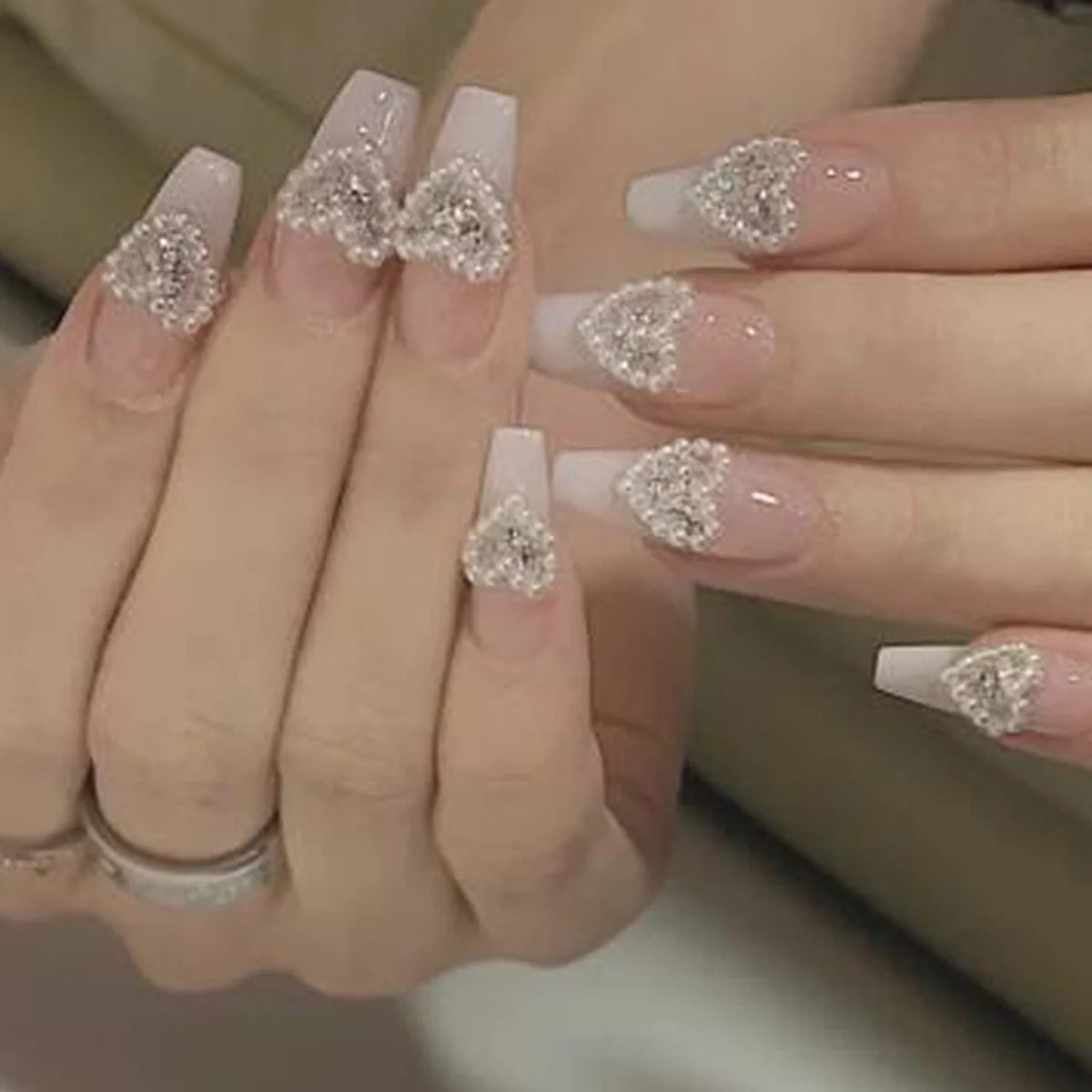 Decorated press-on nail designs shown on hands