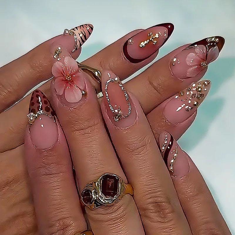 Decorated floral nails shown on hands
