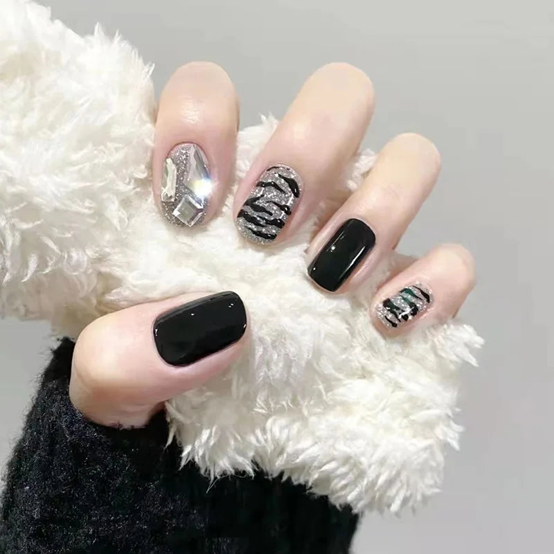 Decorated nail designs shown on hands