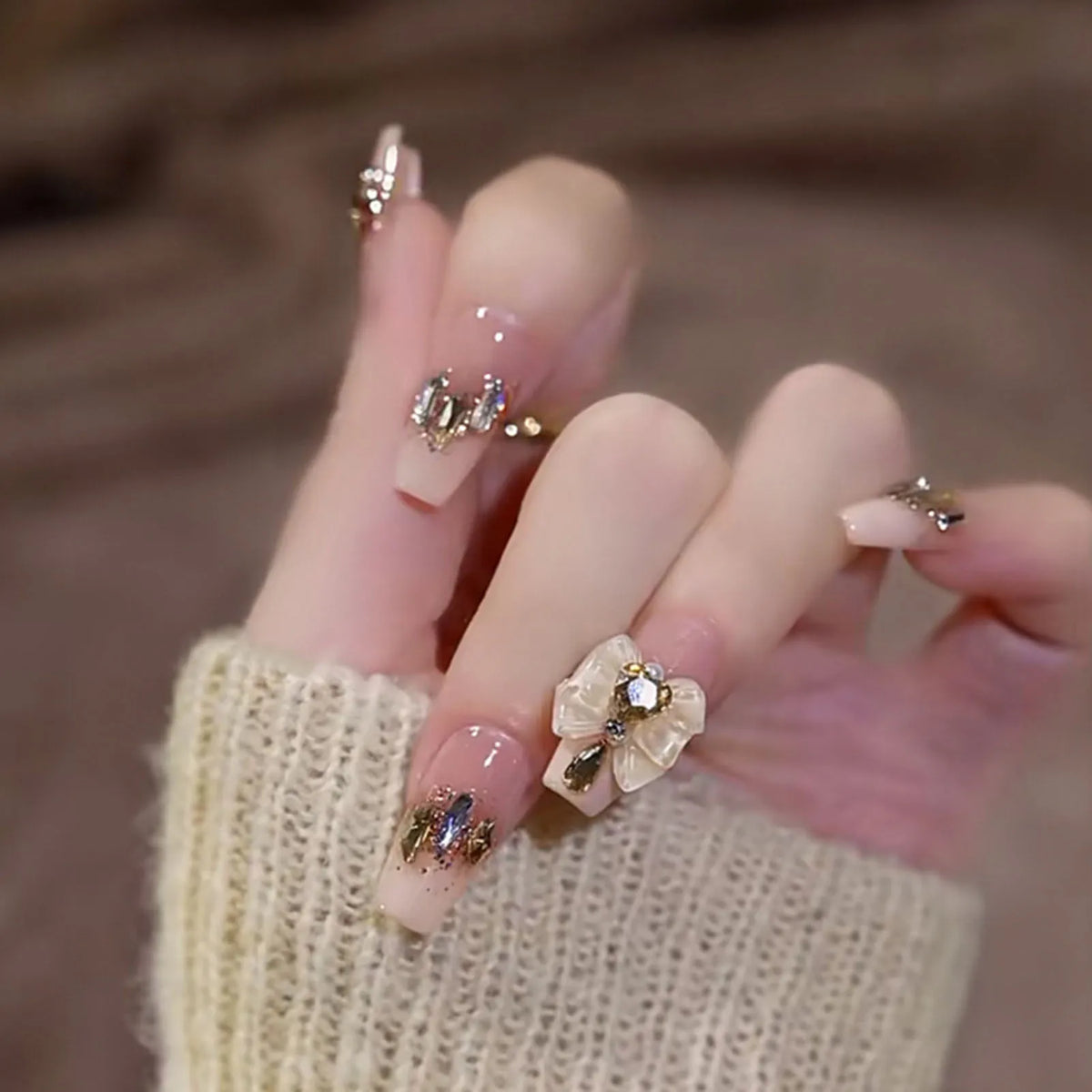 Decorated nail designs shown on hands