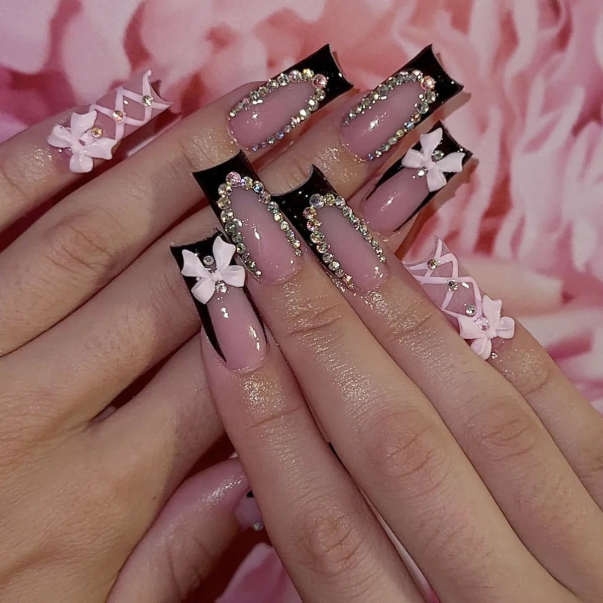 Decorated nail designs shown on hands