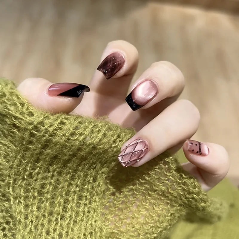 Decorated nail designs shown on hands