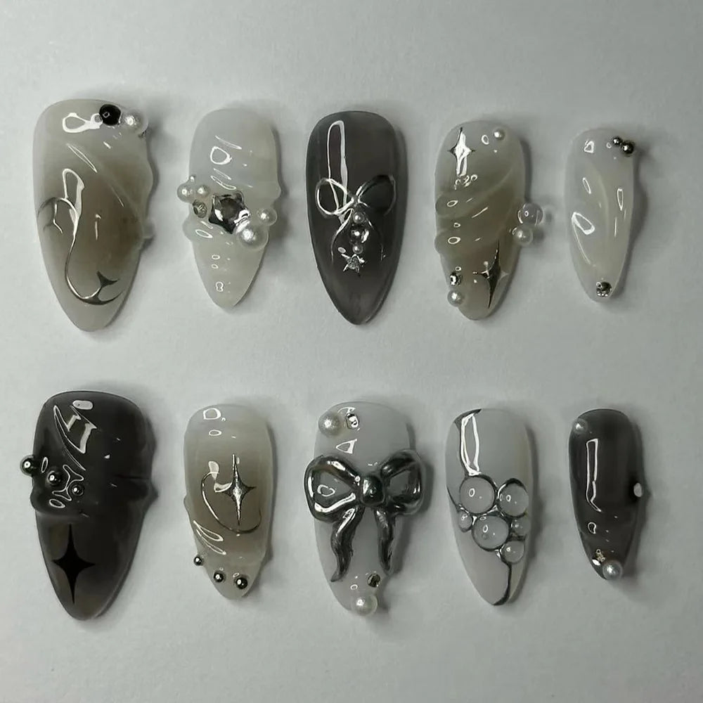 Decorated press-on nails arranged in rows