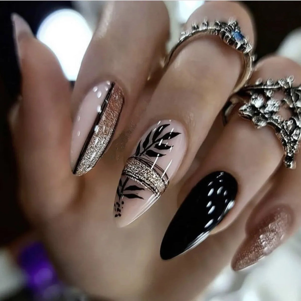 Decorated nail designs shown on hands