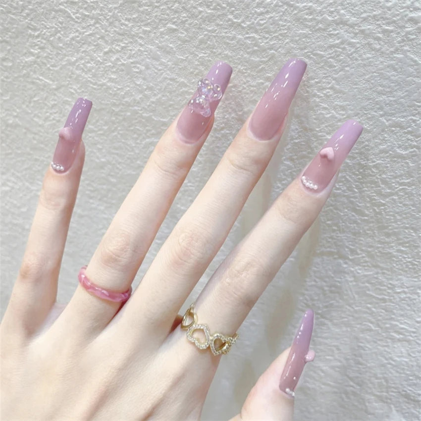 Decorated nail designs shown on hands
