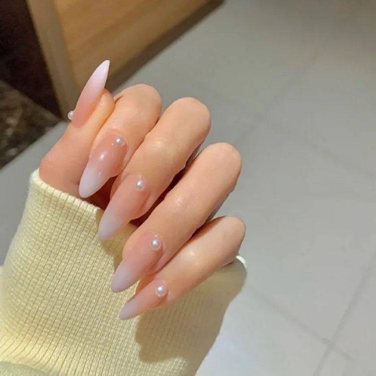 Decorated press-on nail designs shown on hands