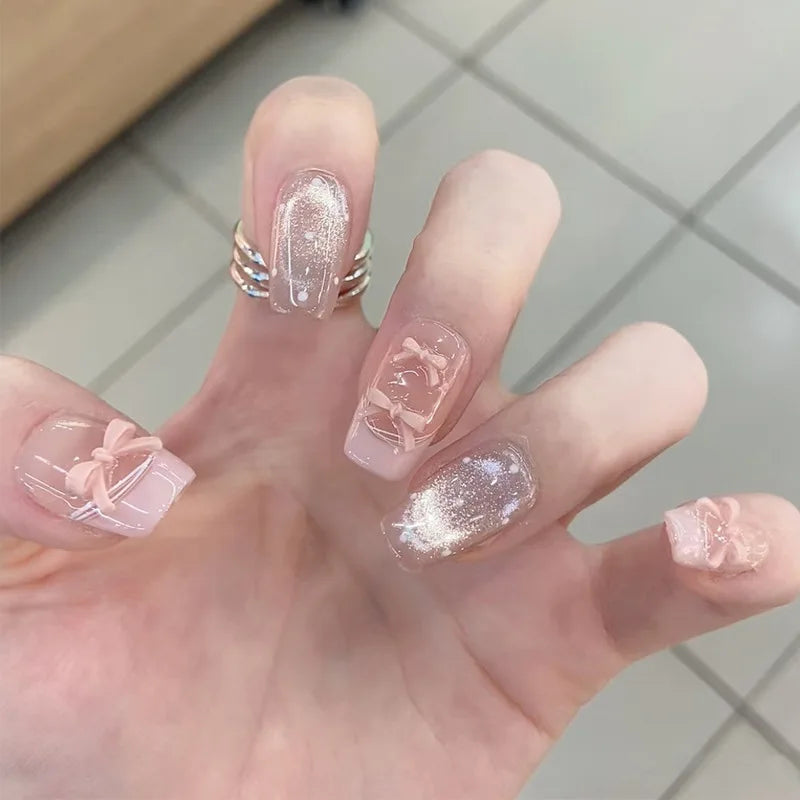 Decorated nail designs shown on hands