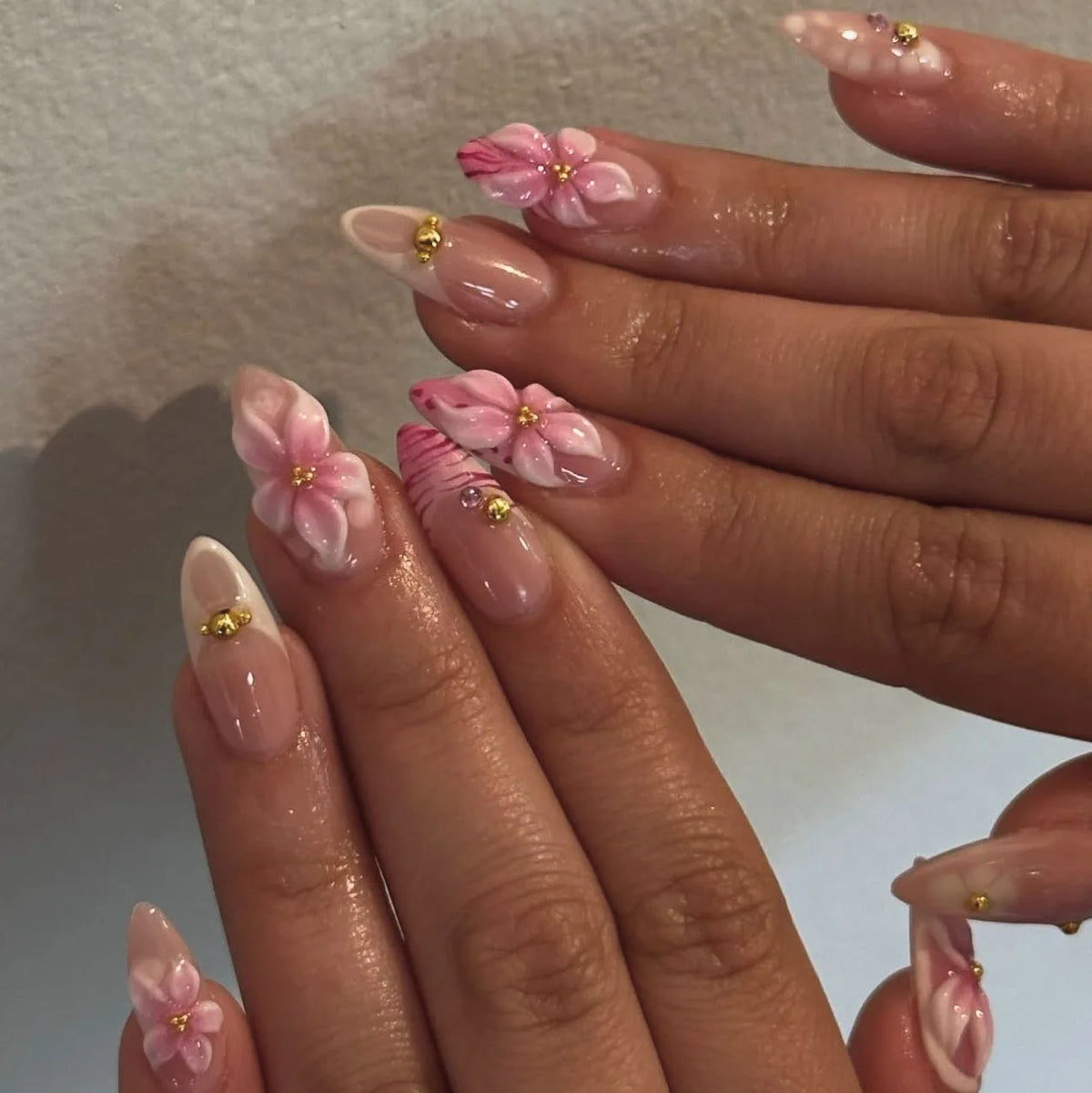 Decorated nails shown on hands