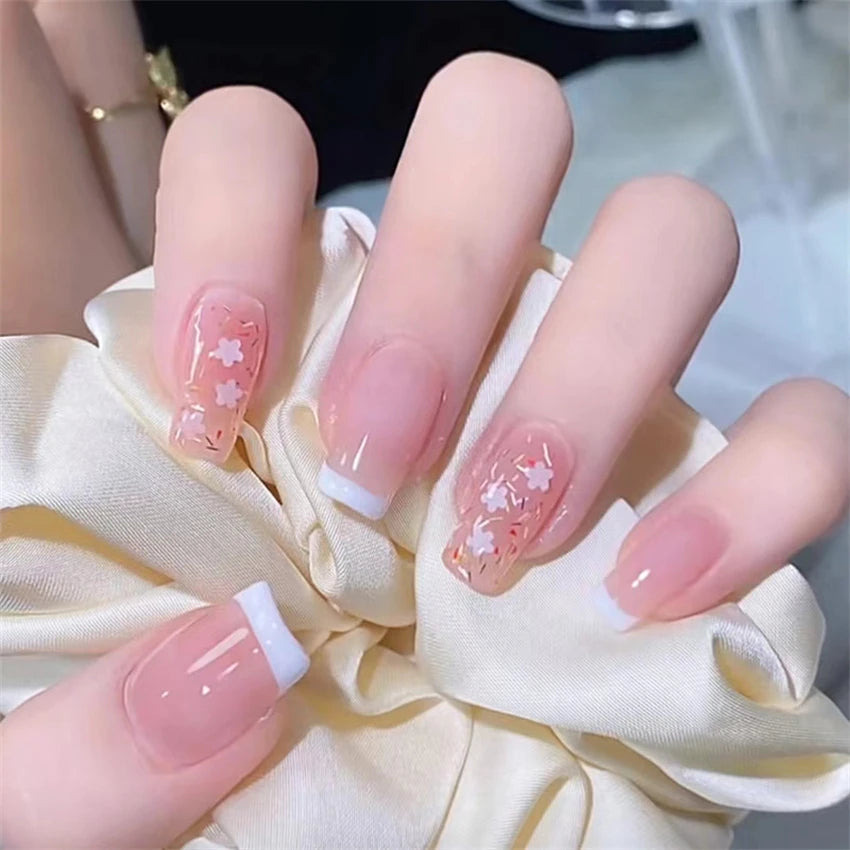 Decorated nail designs shown on hands