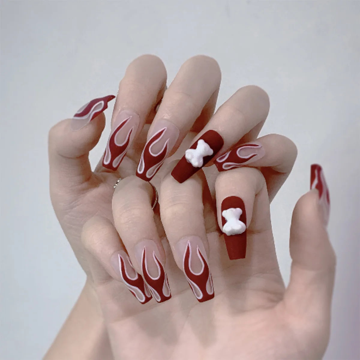 Decorated nail designs shown on hands