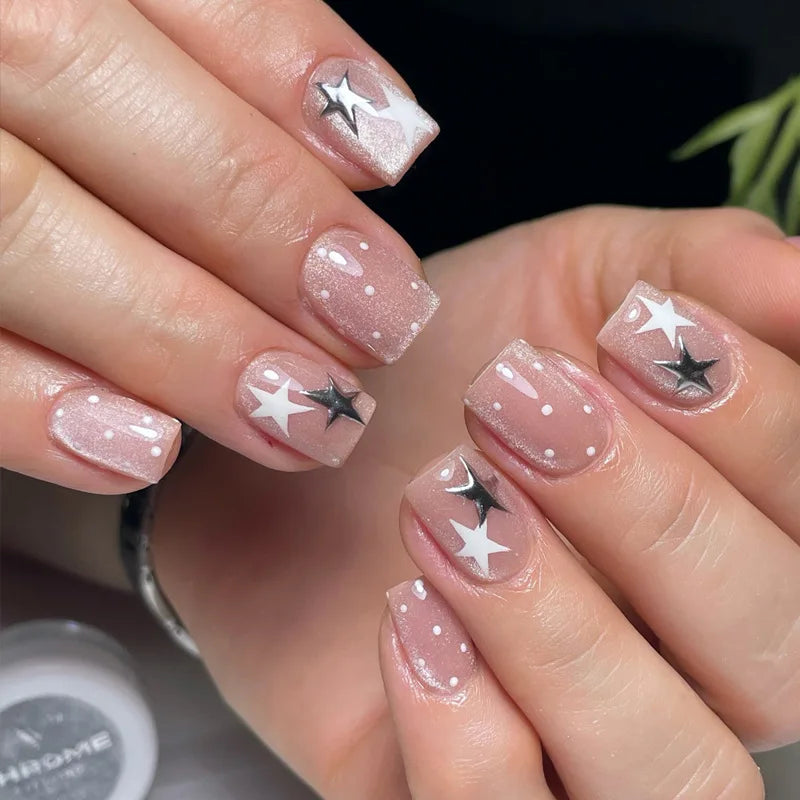 Decorated nail designs shown on hands