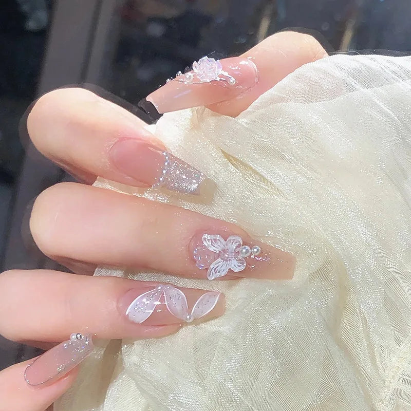 Decorated nail designs shown on hands