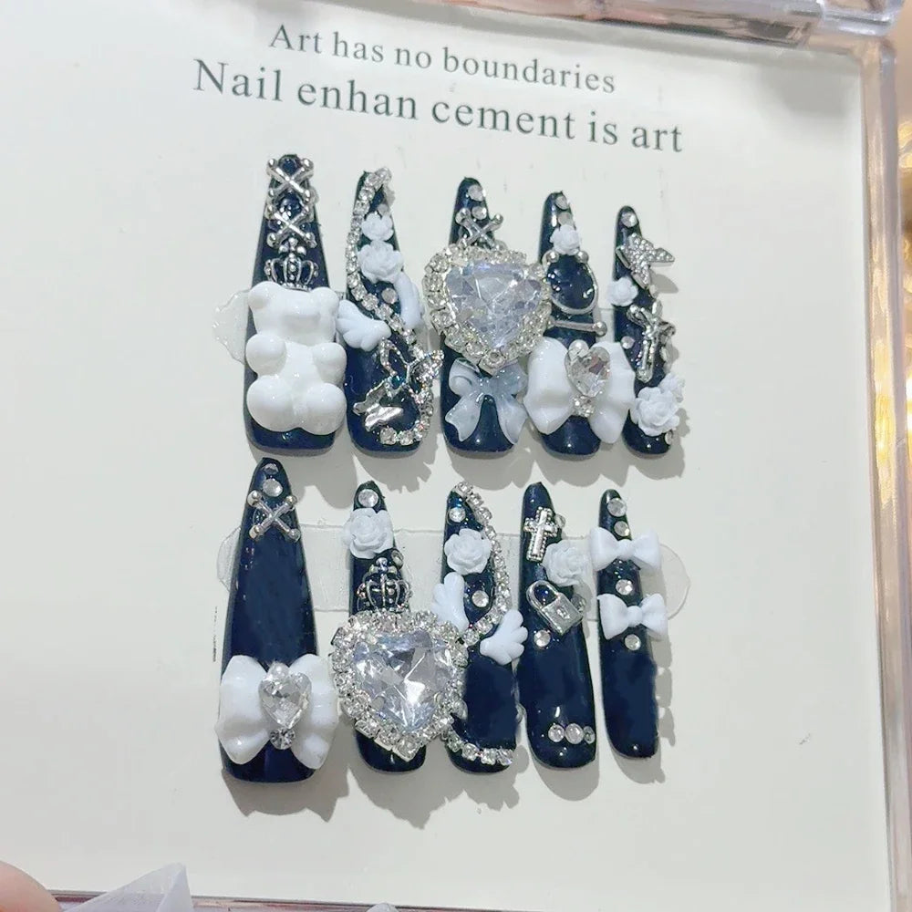 Decorated press-on nail sets with raised embellishments on display cards