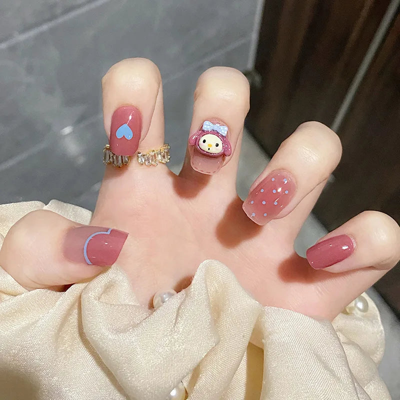 Decorated nail designs shown on hands