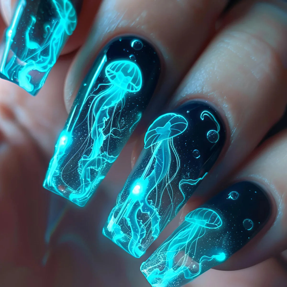 Colorful marine-themed nail artwork shown on hands