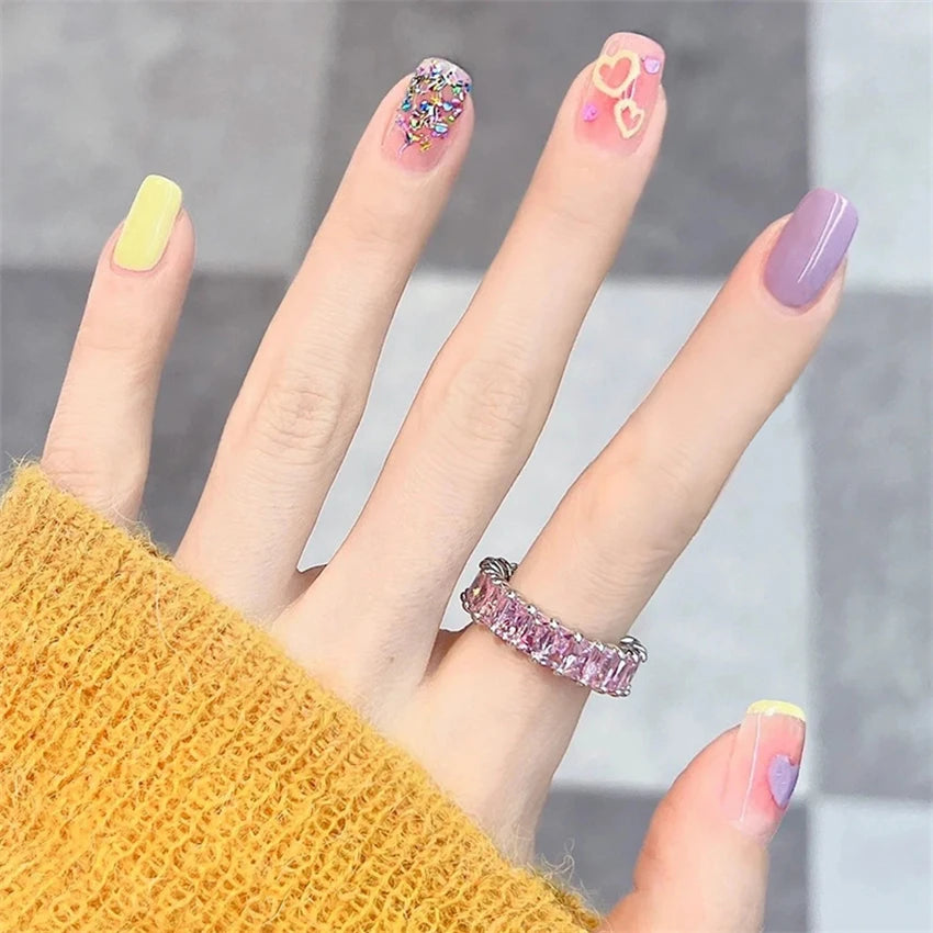 Decorated nail designs shown on hands