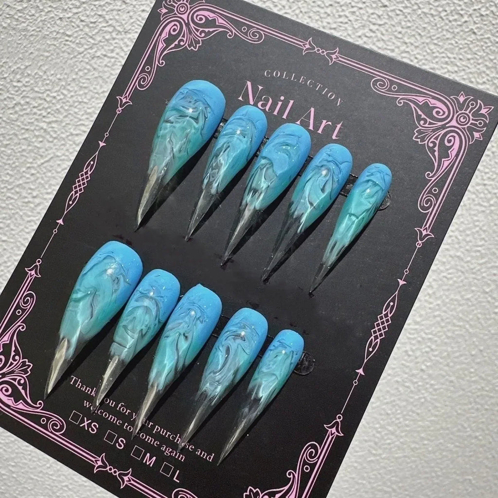 Decorated pointed press-on nails arranged in two rows