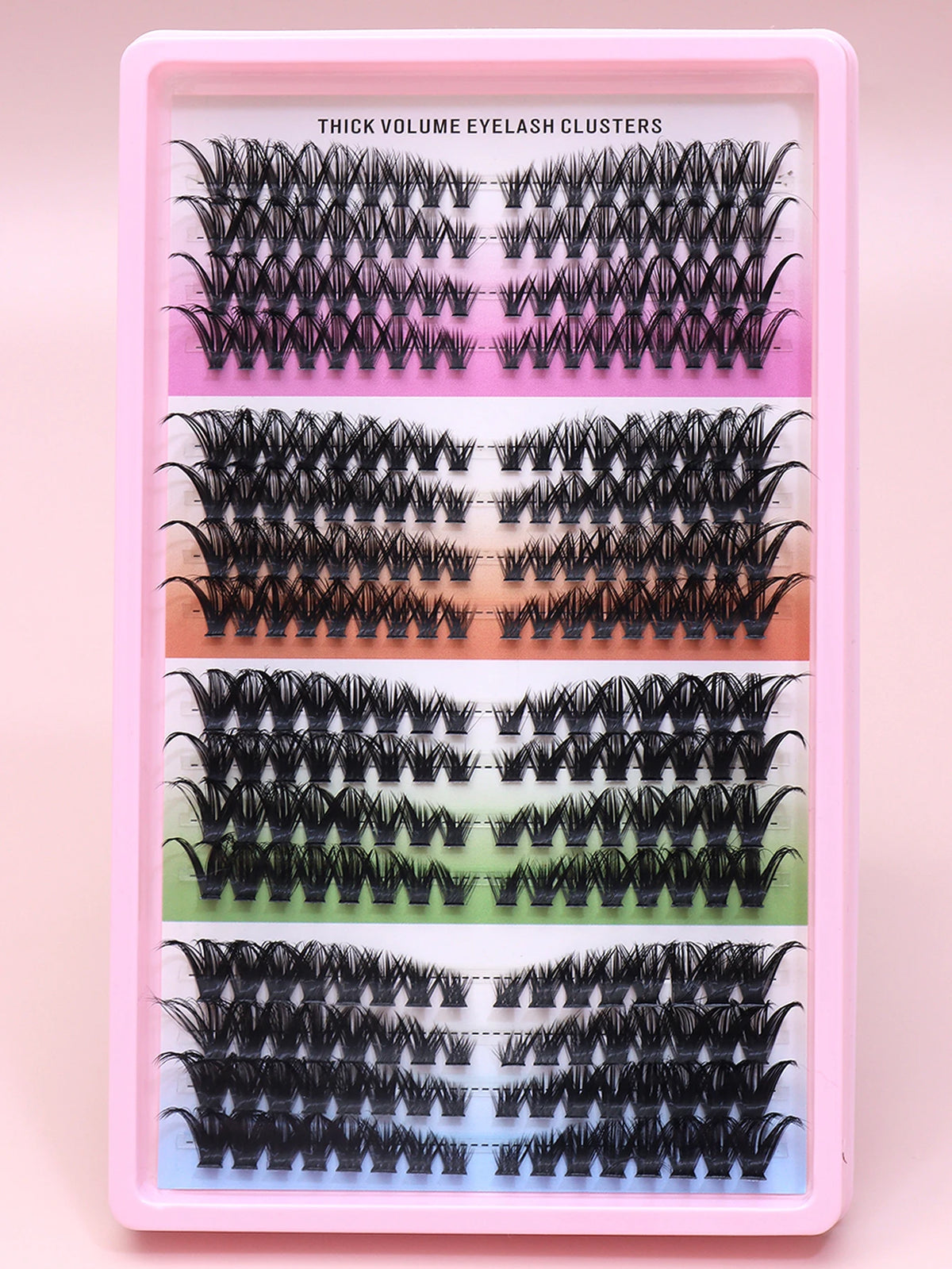 False eyelash clusters arranged in rows in a tray