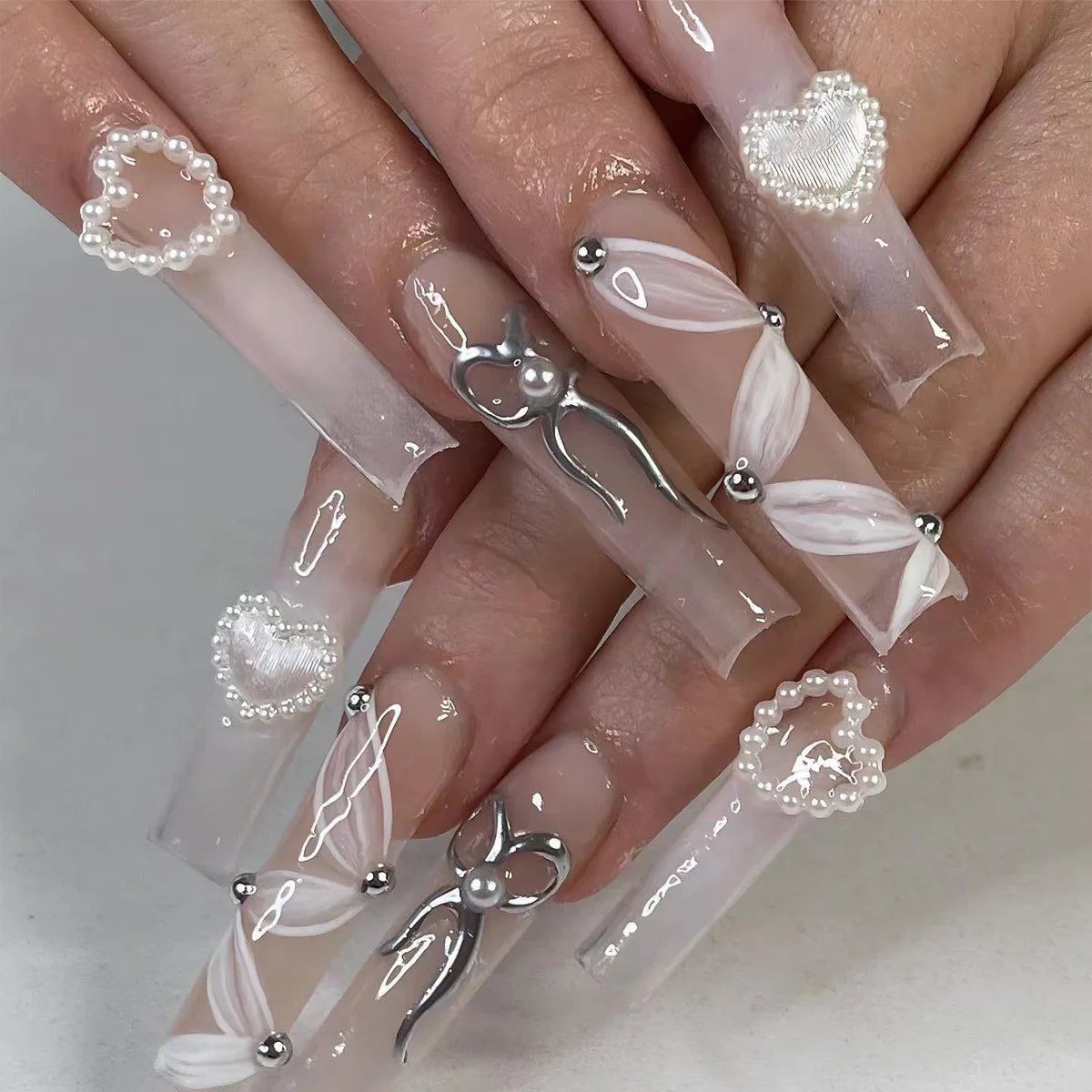 Decorated nail designs shown on hands